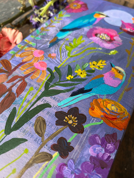 Colorful painting with floral and bird patterns on a canvas surface